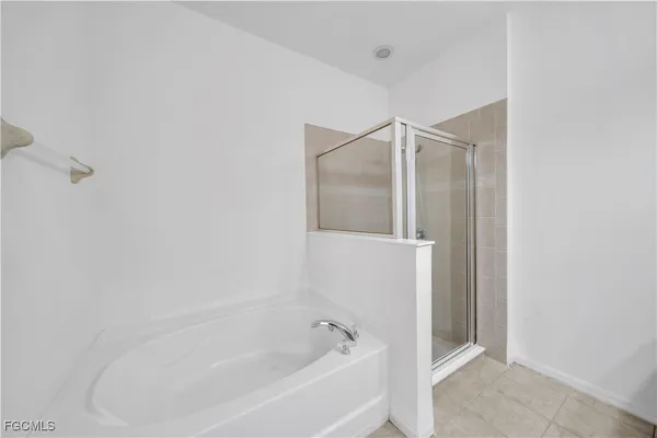 a bathroom with a granite countertop sink toilet and bathtub