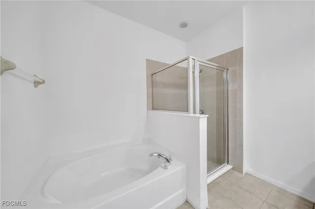 a bathroom with a granite countertop sink toilet and bathtub