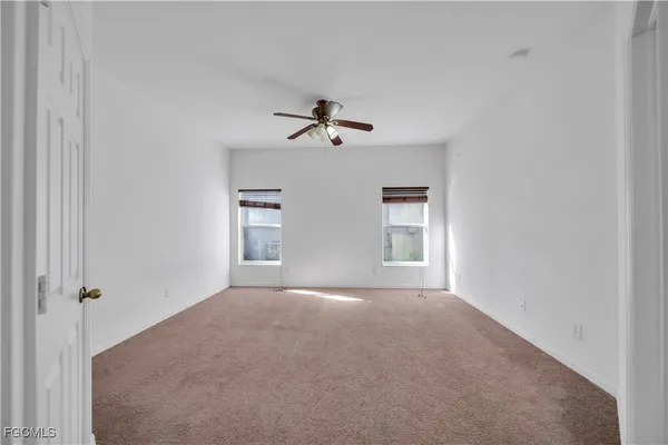 an aerial view of residential houses with outdoor space and street view