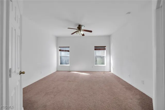 an aerial view of residential houses with outdoor space and street view