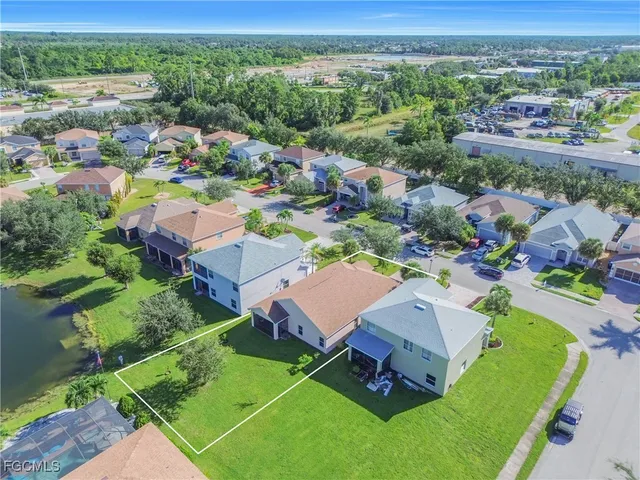 an aerial view of a house with outdoor space