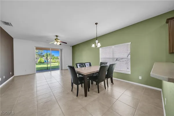 a dining room with furniture and window