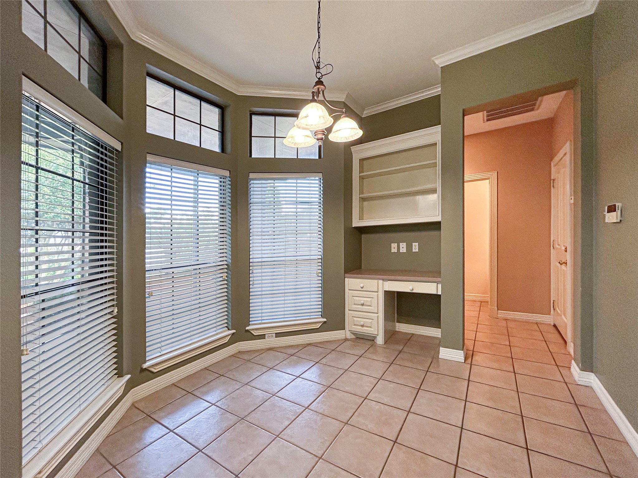 606 Walnut Street Lake Jackson, TX 77566 - Photo 15 of 43 a view of an empty room with window cabinet and fire place