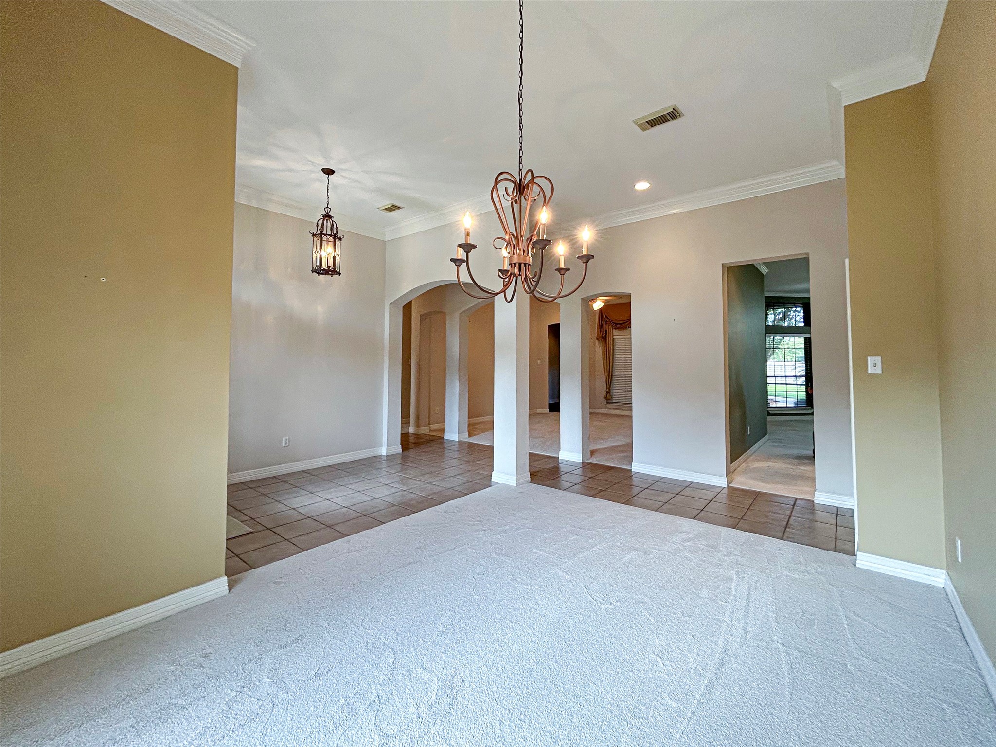 606 Walnut Street Lake Jackson, TX 77566 - Photo 16 of 43 a view of a chandelier in a room with a chandelier