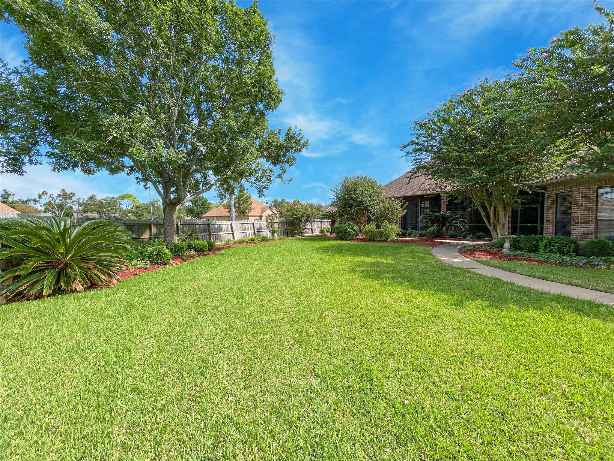 606 Walnut Street Lake Jackson, TX 77566 - Photo 41 of 43 a view of a house with a big yard