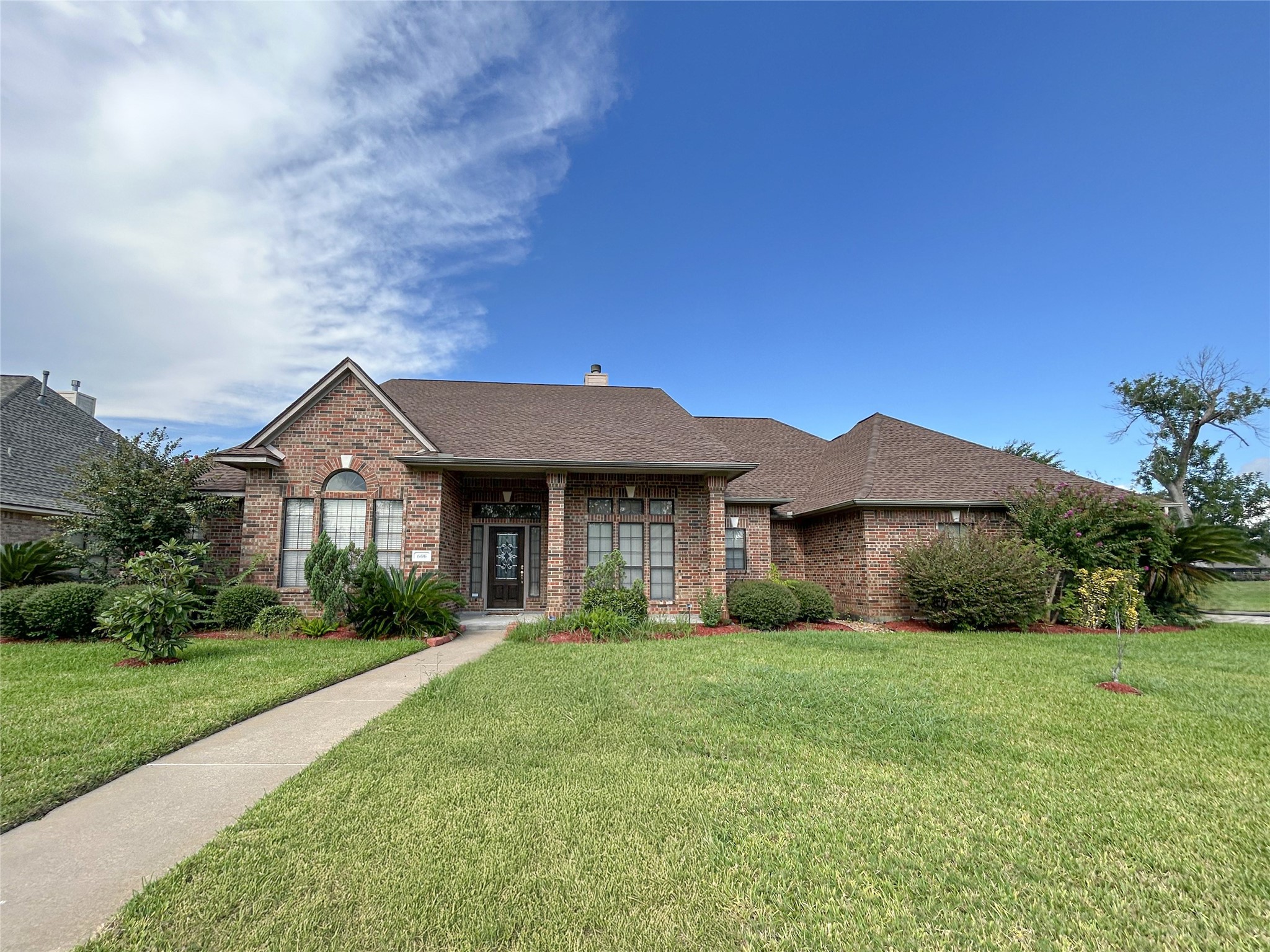 606 Walnut Street Lake Jackson, TX 77566 - Photo 43 of 43 a front view of a house with yard and green space