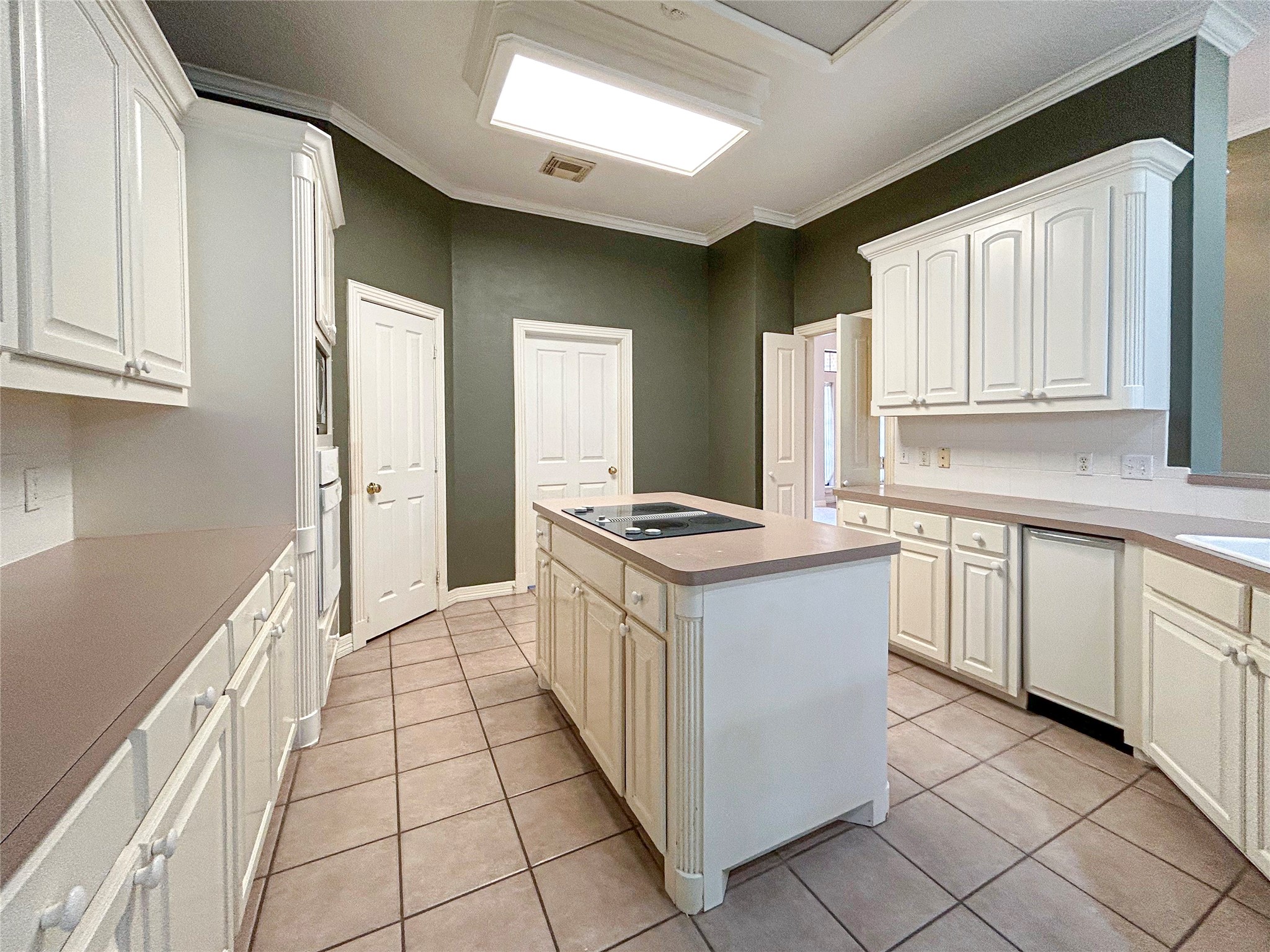 606 Walnut Street Lake Jackson, TX 77566 - Photo 6 of 43 a kitchen with a sink stove and cabinets