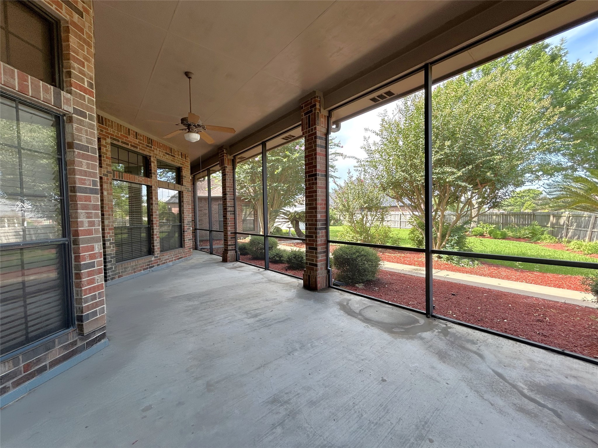 606 Walnut Street Lake Jackson, TX 77566 - Photo 9 of 43 a view of an empty room with sliding glass door and mountain view