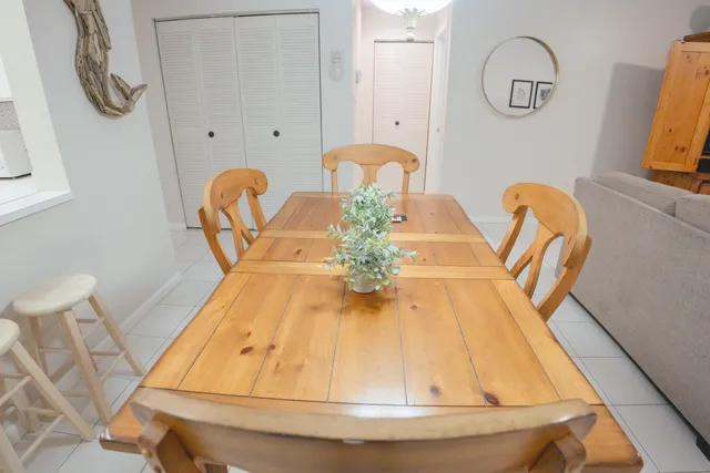 a dining room with furniture and a chandelier