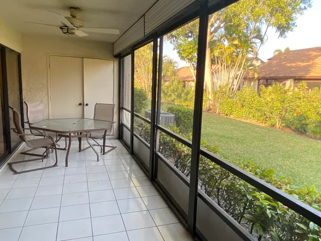 a bedroom with a bed and a lamp