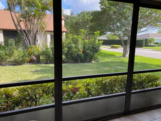 a sign broad in front of flowers