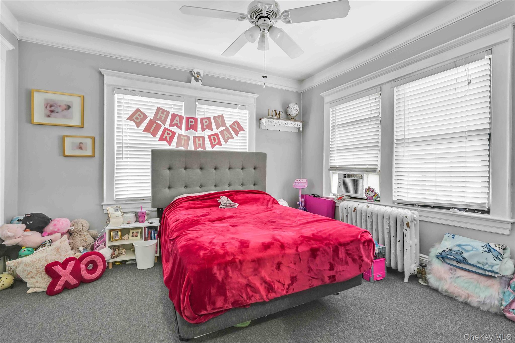 160-08 12th Road Queens, NY 11357 - Photo 12 of 28 a bed room with a bed and a window