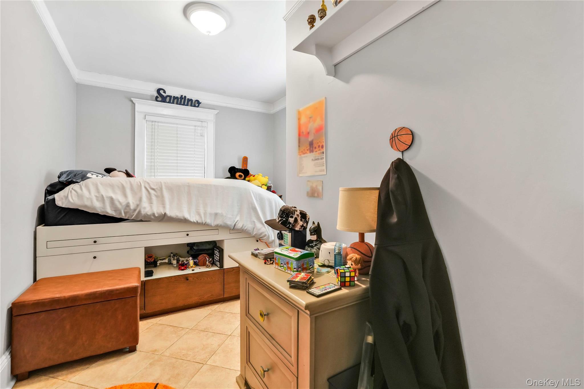 160-08 12th Road Queens, NY 11357 - Photo 13 of 28 a bed room with a bed and a couch