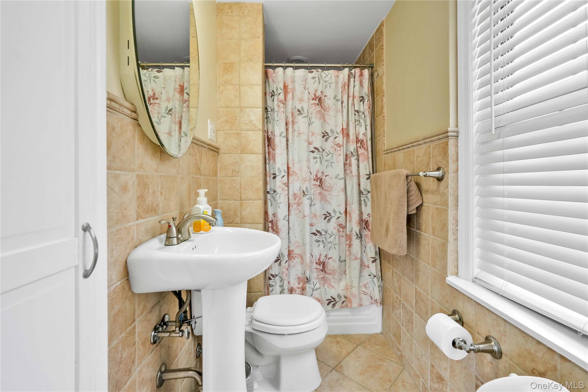 160-08 12th Road Queens, NY 11357 - Photo 7 of 28 a bathroom with a sink toilet and shower
