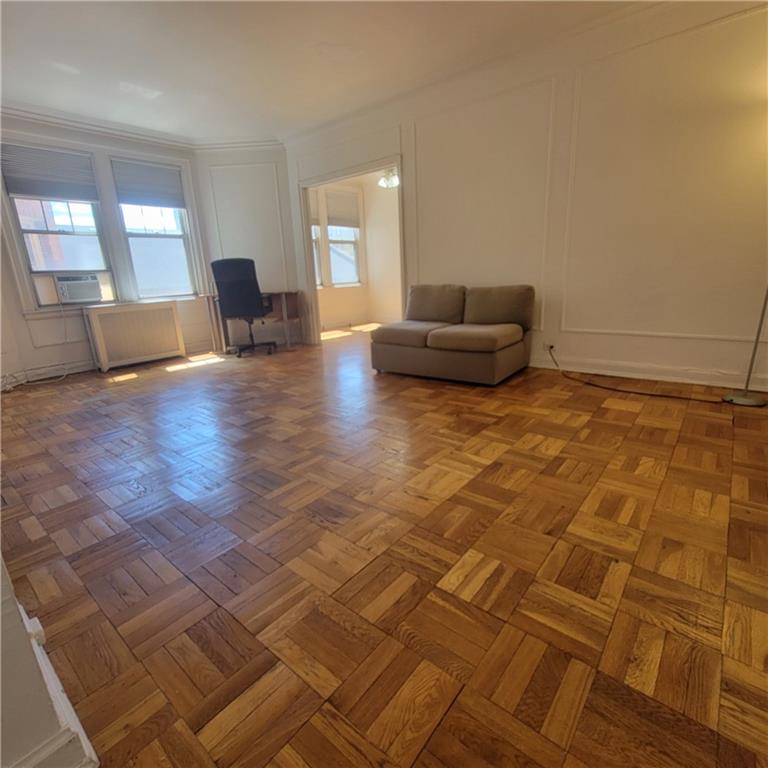 144 North Dithridge Street, Unit 306 Pittsburgh, PA 15213 - Photo 5 of 19 a living room with a couch and a large window