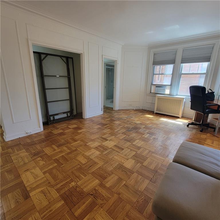 144 North Dithridge Street, Unit 306 Pittsburgh, PA 15213 - Photo 7 of 19 a bedroom with a bed and a chair in it