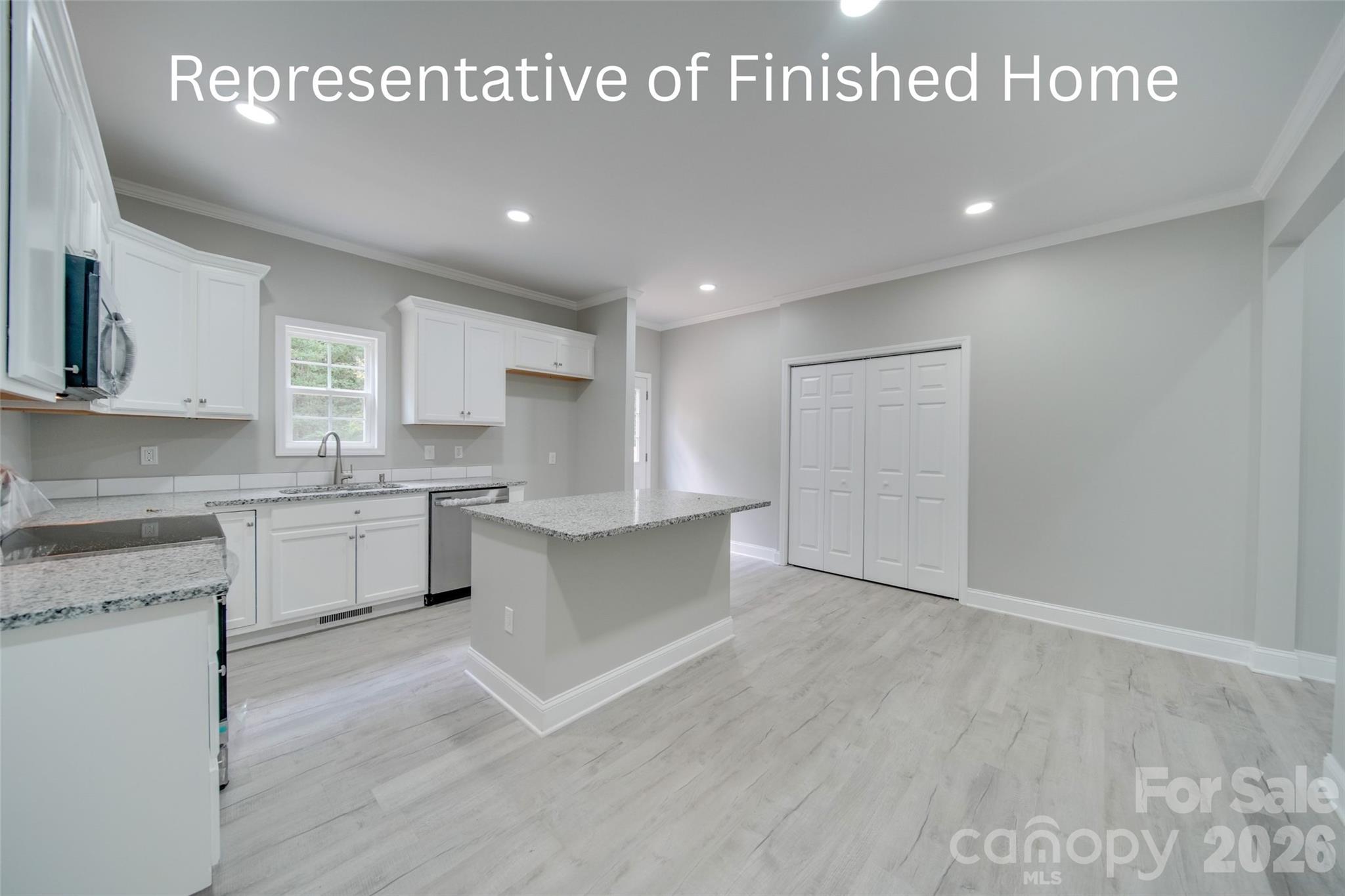 764 Old York Road Chester, SC 29706 - Photo 5 of 5 a large kitchen with stainless steel appliances granite countertop a stove a sink and white cabinets