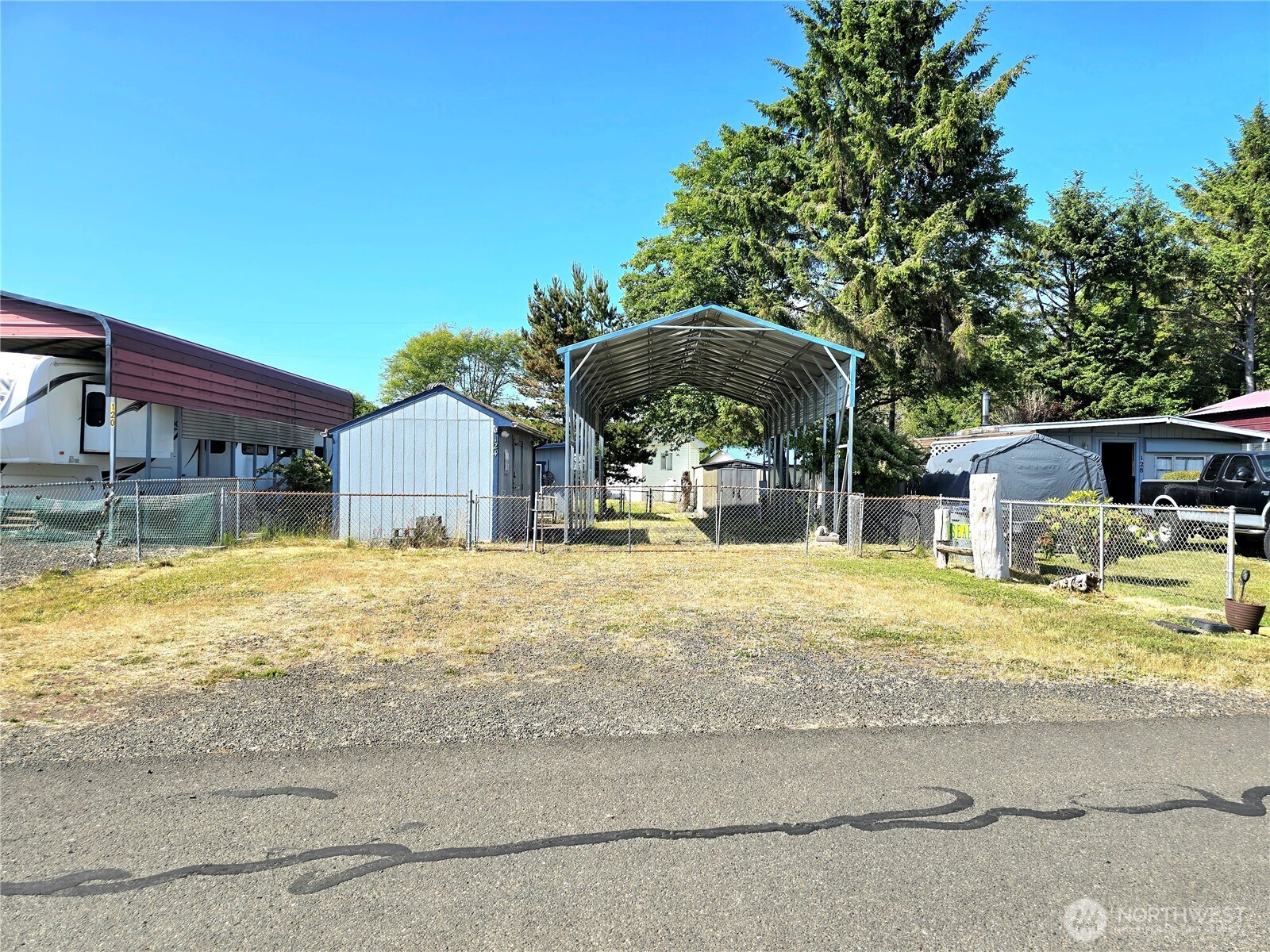 124 Vitoria Loop Ocean Shores, WA 98569 - Photo 26 of 26 a swimming pool covered with buildings in the background