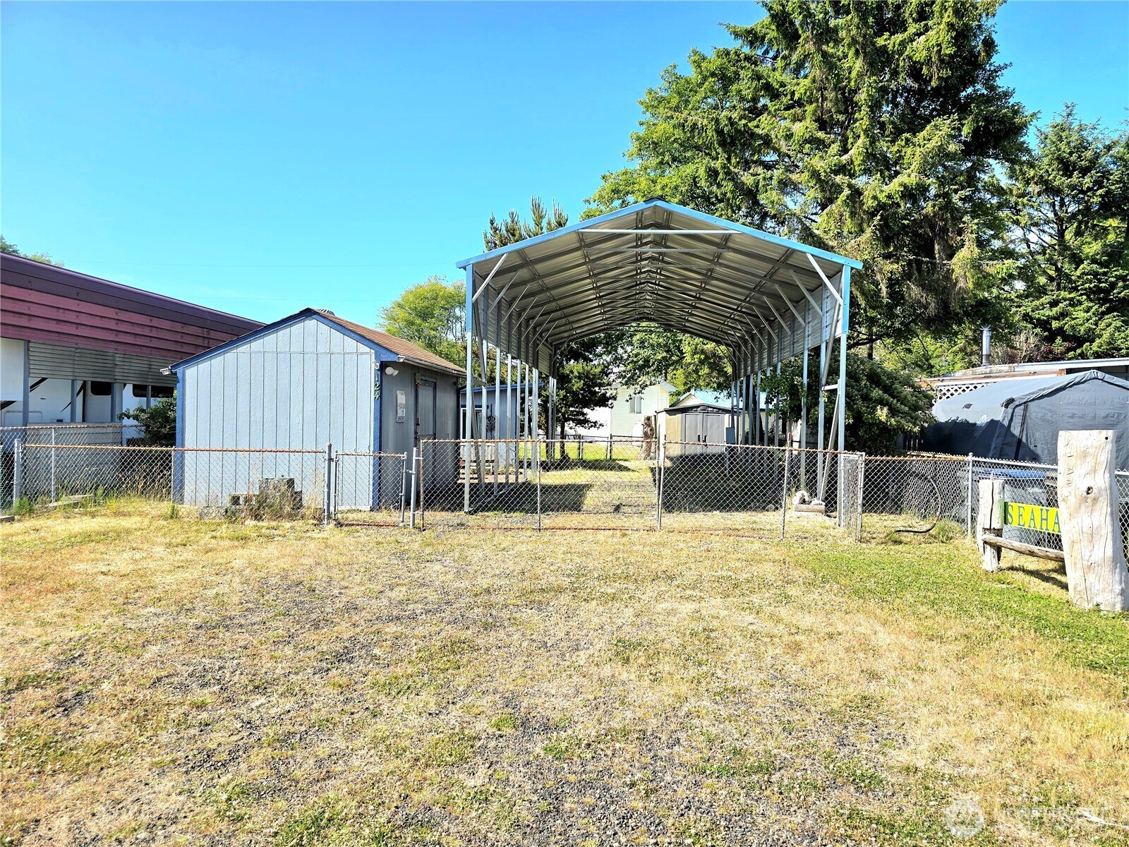 124 Vitoria Loop Ocean Shores, WA 98569 - Photo 6 of 26 a house view with swimming pool in front of it