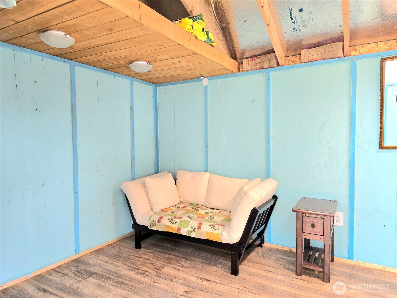 124 Vitoria Loop Ocean Shores, WA 98569 - Photo 9 of 26 a bench sitting on wooden floor