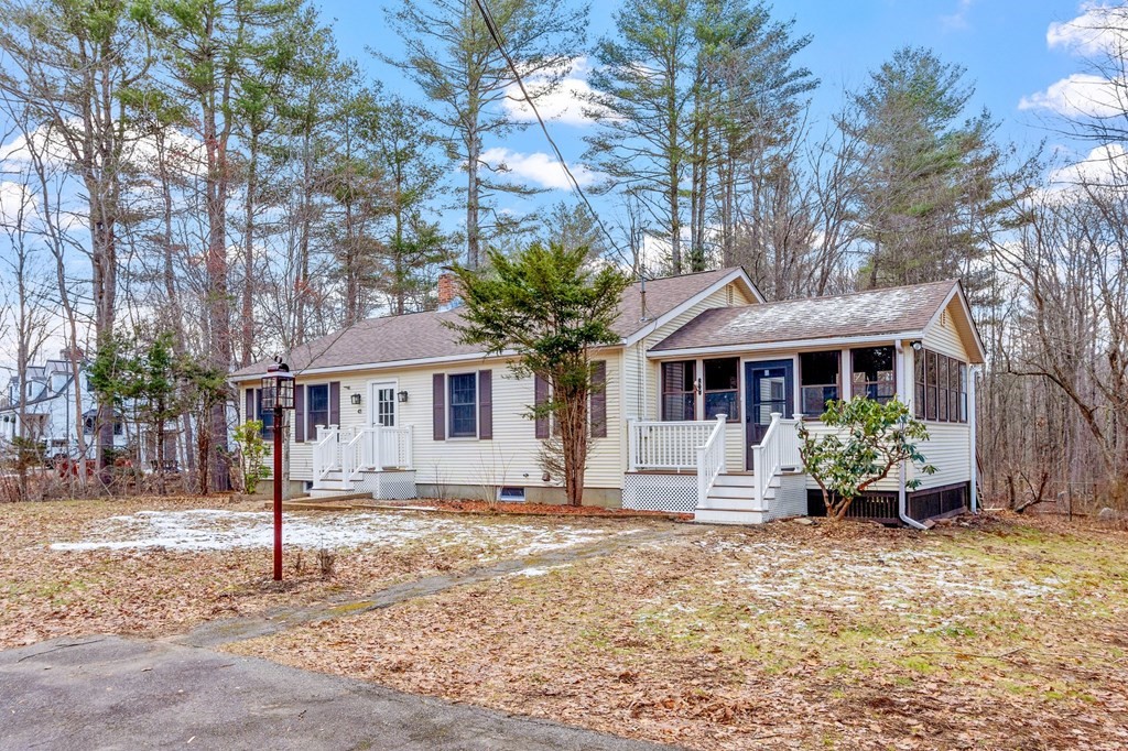 43 Hadley Road Merrimac, MA 01860 - Photo 1 of 19 a front view of a house with garden