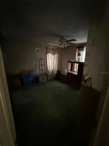 a living room with hard wood floor