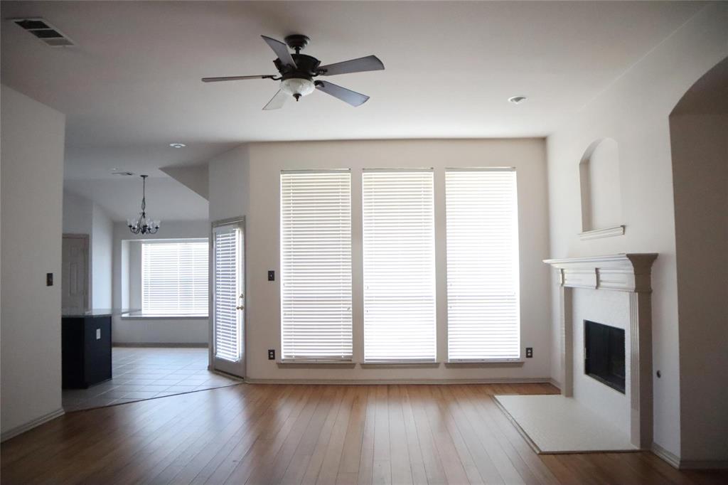 6510 Valley Forge Drive Rowlett, TX 75089 - Photo 4 of 14 a view of an empty room with a window and wooden floor