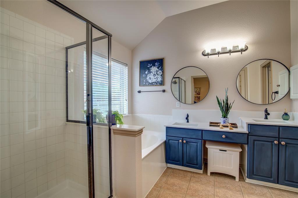 6510 Valley Forge Drive Rowlett, TX 75089 - Photo 7 of 14 a bathroom with a double vanity sink and a mirror