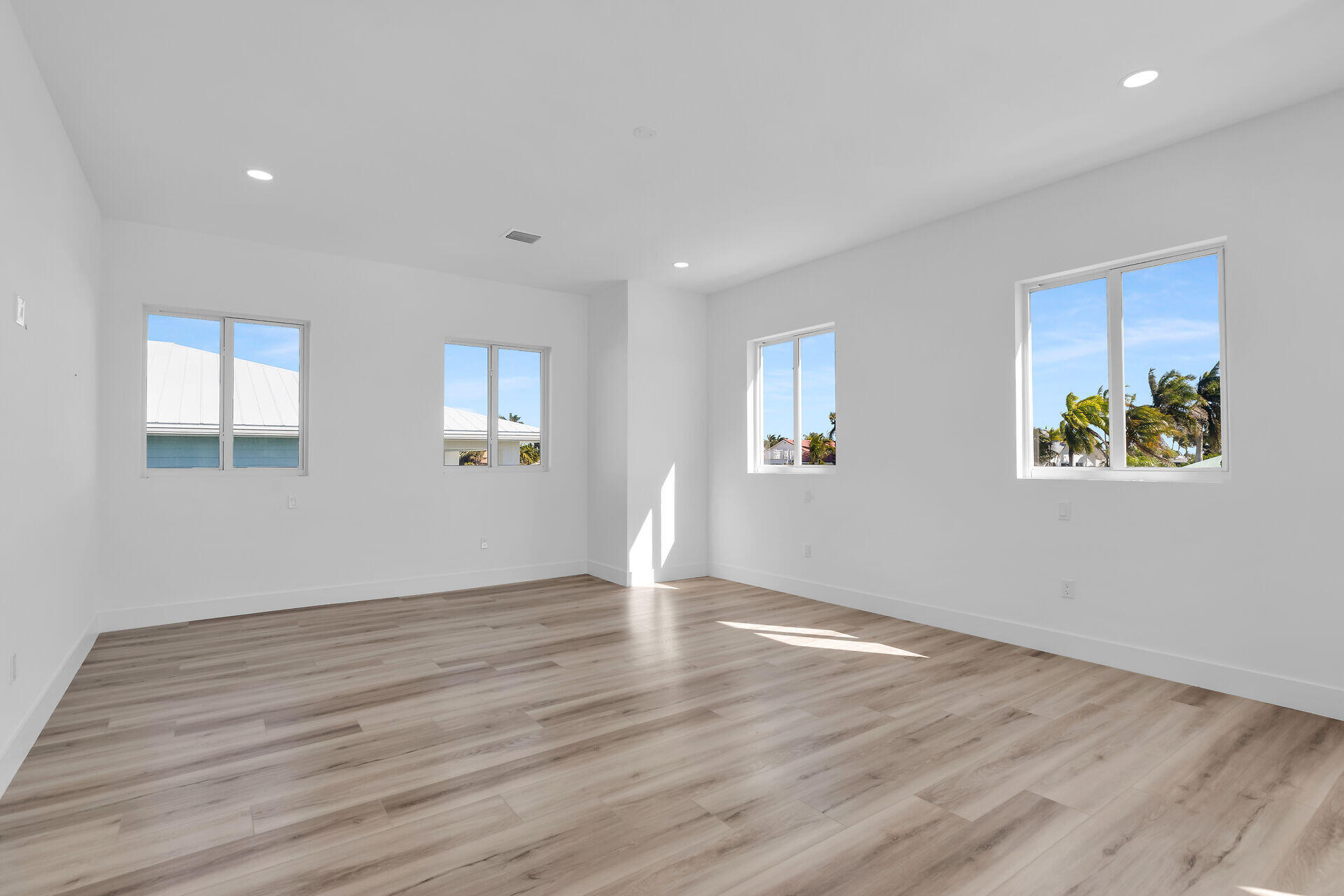 240 14th Street Key Colony Beach, FL 33051 - Photo 25 of 93 a view of an empty room with wooden floor and a window