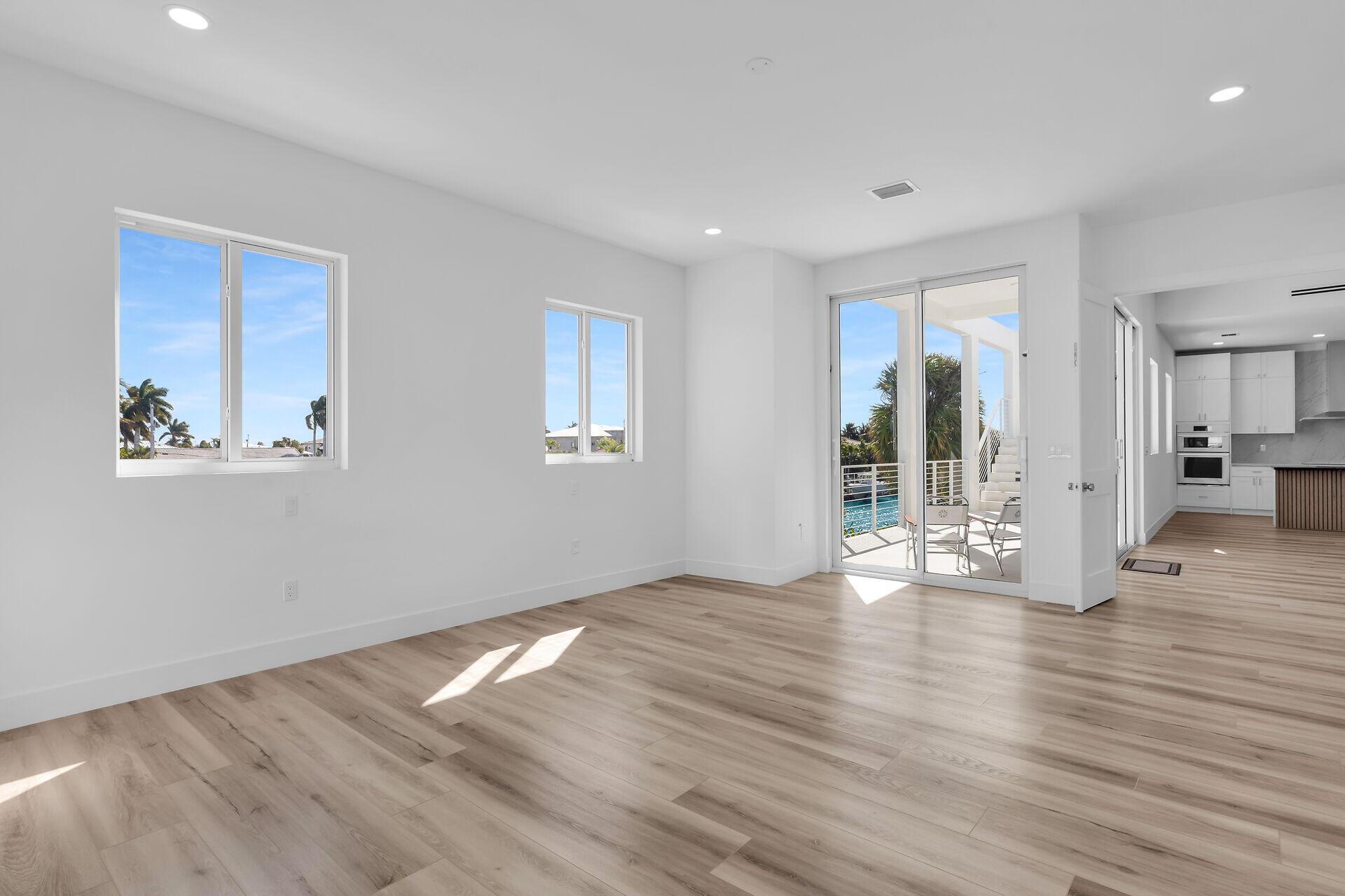 240 14th Street Key Colony Beach, FL 33051 - Photo 26 of 93 a view of an empty room with wooden floor and a window