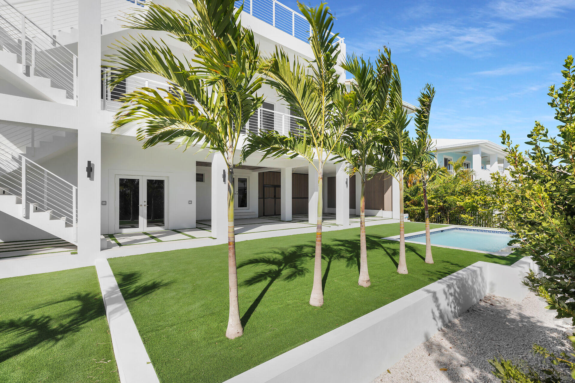 240 14th Street Key Colony Beach, FL 33051 - Photo 68 of 93 a view of a house with a swimming pool