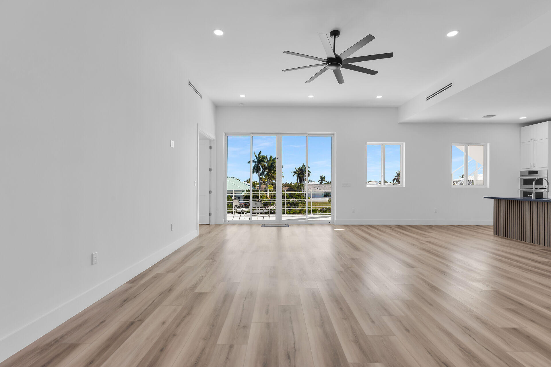 240 14th Street Key Colony Beach, FL 33051 - Photo 8 of 93 a view of a livingroom with a hardwood floor and a ceiling fan