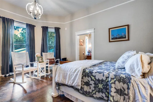 a bedroom with a bed and a table