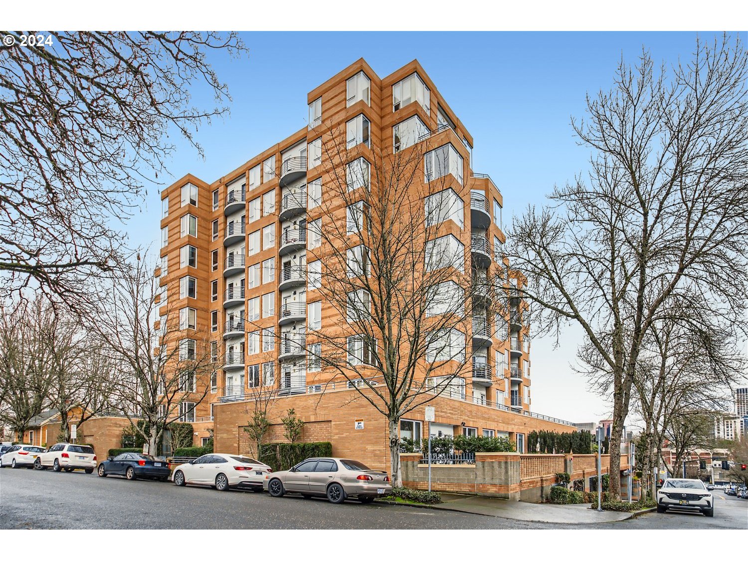 1132 Southwest 19th Avenue, Unit 309 Portland, OR 97205 - Photo 1 of 32 a view of a building with a yard