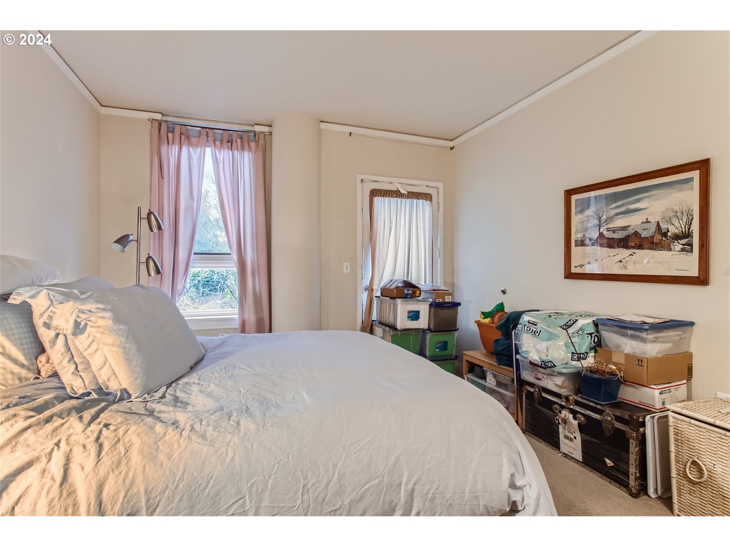 1132 Southwest 19th Avenue, Unit 309 Portland, OR 97205 - Photo 18 of 32 a bedroom with a bed and wooden floor