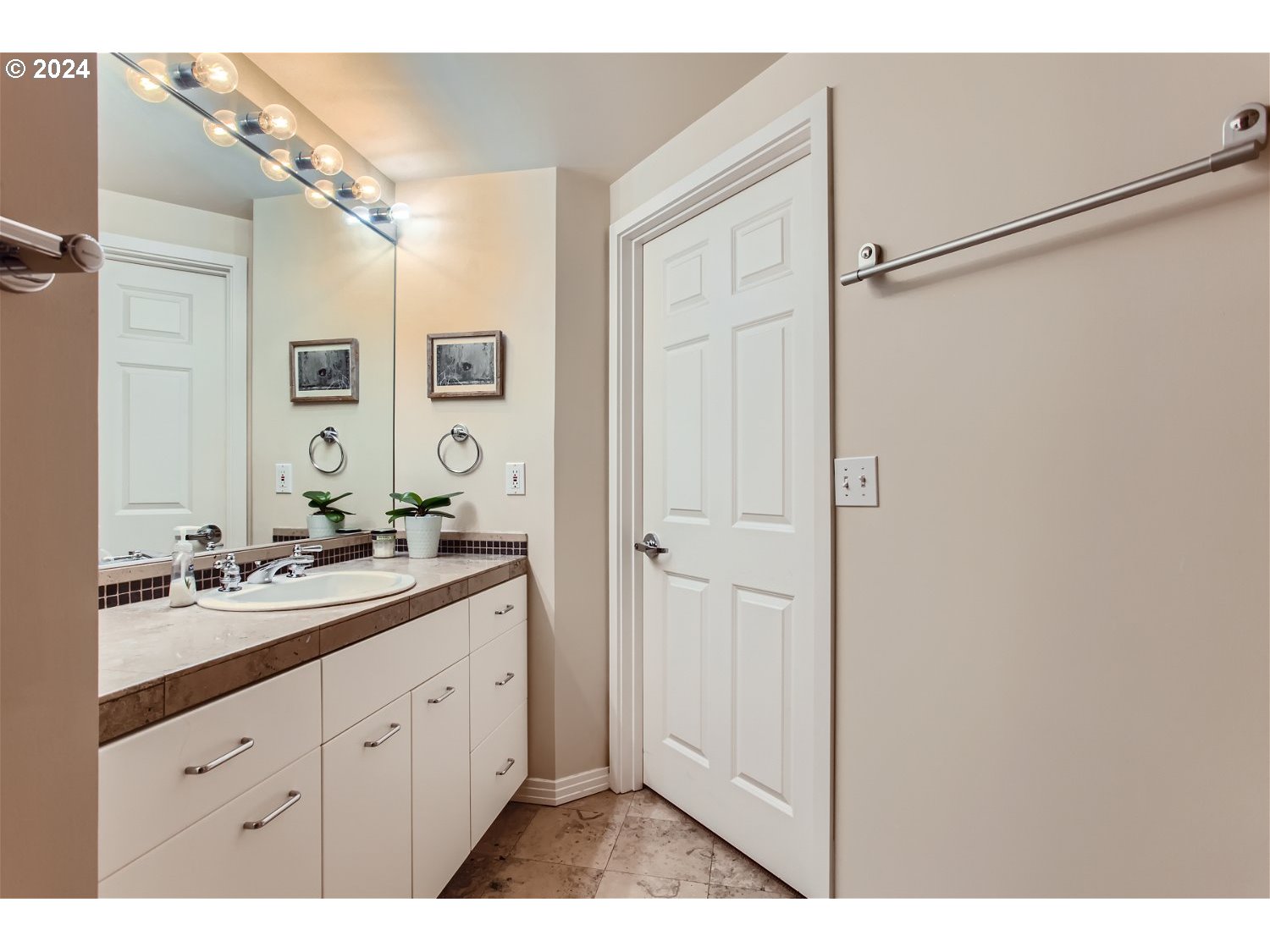 1132 Southwest 19th Avenue, Unit 309 Portland, OR 97205 - Photo 20 of 32 a spacious bathroom with a double vanity sink a mirror and shower