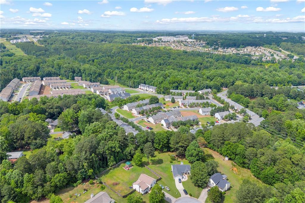 1498 Box Circle Winder, GA 30680 - Photo 8 of 56 an aerial view of residential houses with outdoor space and trees