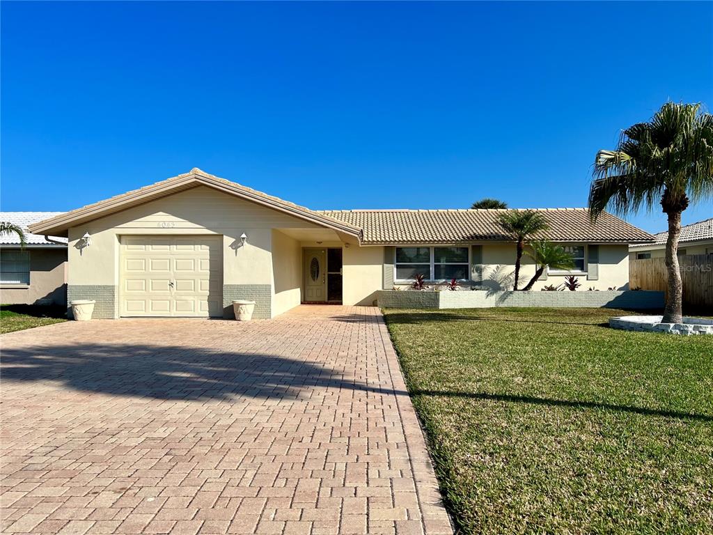 4043 Topsail Trail New Port Richey, FL 34652 - Photo 1 of 1 a front view of a house with a yard