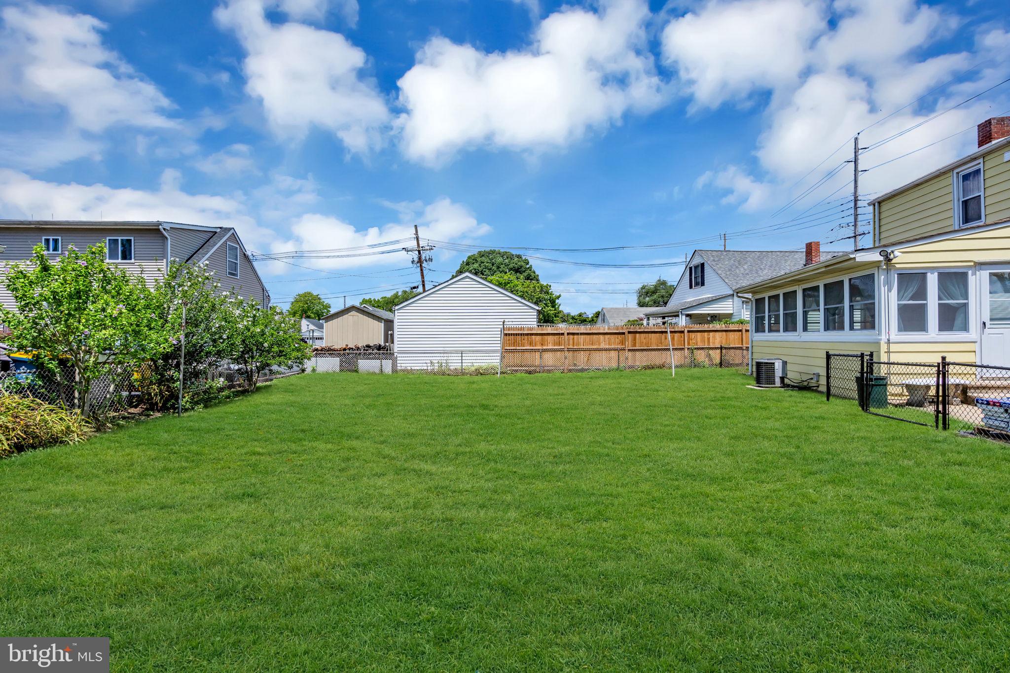 826 Whitehorse Mercerville Road Hamilton, NJ 08610 - Photo 26 of 31 Spacious green yard under blue skies.