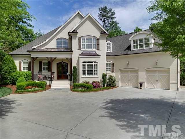 3112 Briar Stream Run Raleigh, NC 27612 - Photo 1 of 25 a front view of a house with a yard and garage