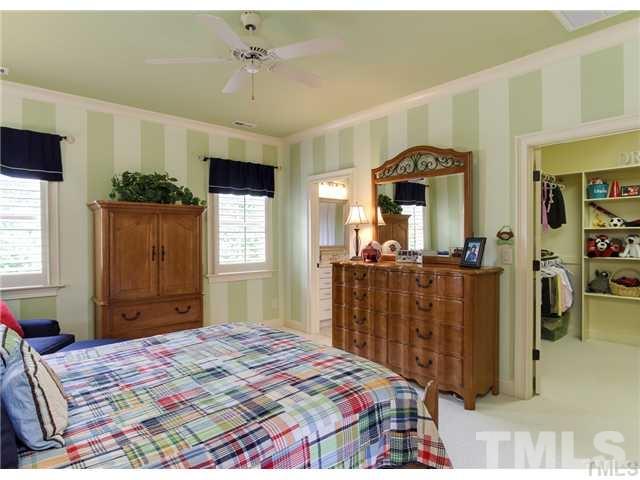 3112 Briar Stream Run Raleigh, NC 27612 - Photo 14 of 25 a bedroom with a bed and a dresser