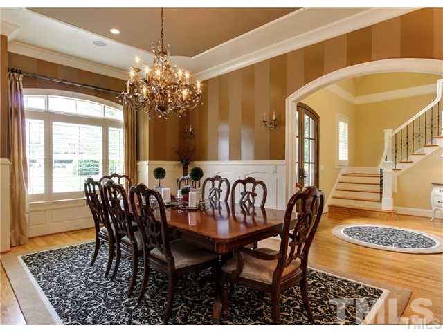 3112 Briar Stream Run Raleigh, NC 27612 - Photo 4 of 25 a view of a dining room with furniture and a chandelier