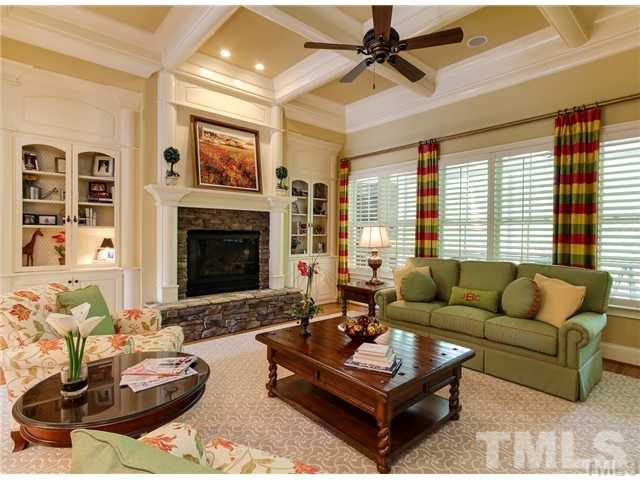 3112 Briar Stream Run Raleigh, NC 27612 - Photo 5 of 25 a living room with furniture fireplace and a large window