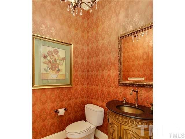 3112 Briar Stream Run Raleigh, NC 27612 - Photo 10 of 25 a bathroom with a toilet and a shower curtain