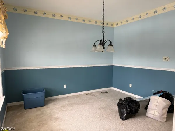 a bedroom with a large bed and cabinets