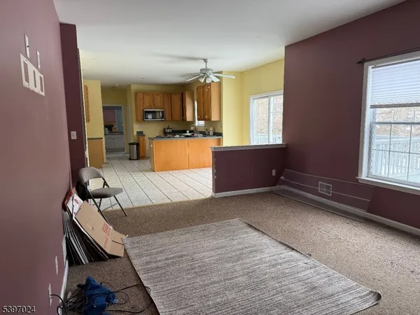 a living room with furniture and a window