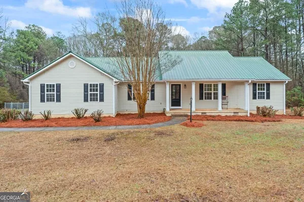 front view of a house with a yard