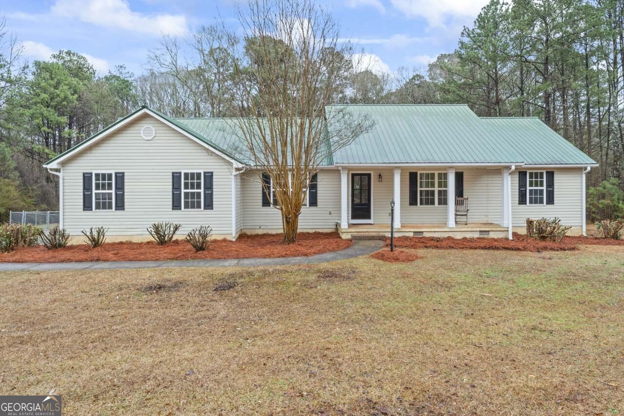 2093 Highway 36 Milner, GA 30257 - Photo 1 of 18 front view of a house with a yard