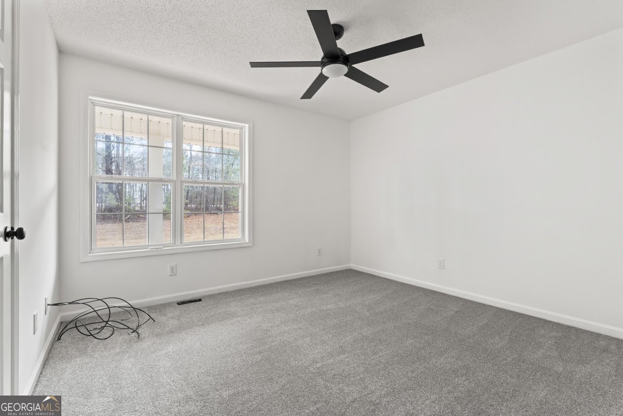 2093 Highway 36 Milner, GA 30257 - Photo 15 of 18 an empty room with a window