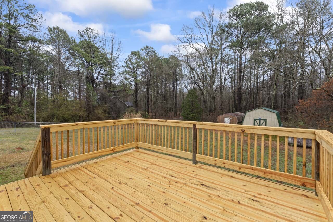 2093 Highway 36 Milner, GA 30257 - Photo 3 of 18 a view of deck with mountain view and wooden floor